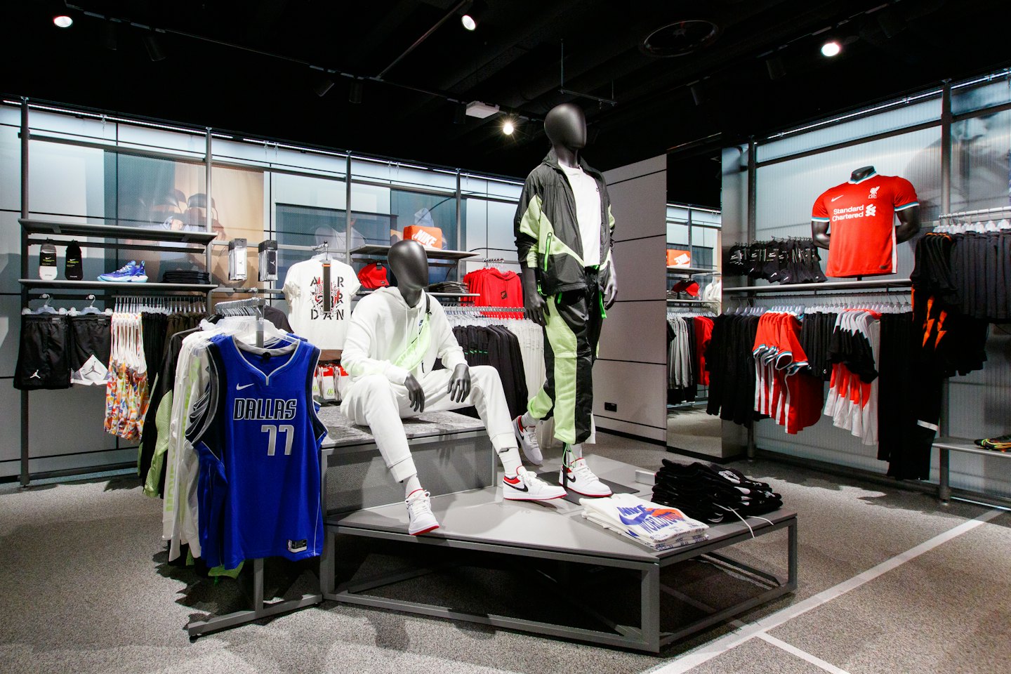 Mannequins in a modern sportswear store wearing athletic clothing.
